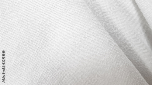 Folded white towel plain backround