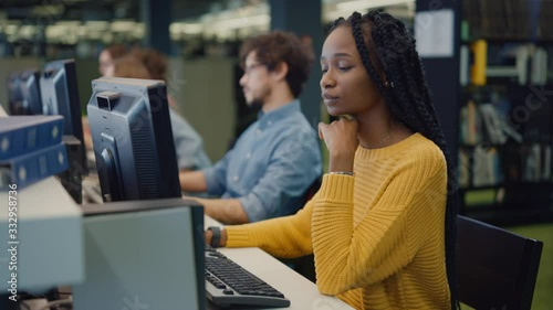 Wallpaper Mural University Library: Gifted Beautiful Black Girl using Computer for Class Assignment. Diverse Multi-Ethnic Group of Students Learning, Studying for Exams, Work on Computers, Talk in College Study Room Torontodigital.ca