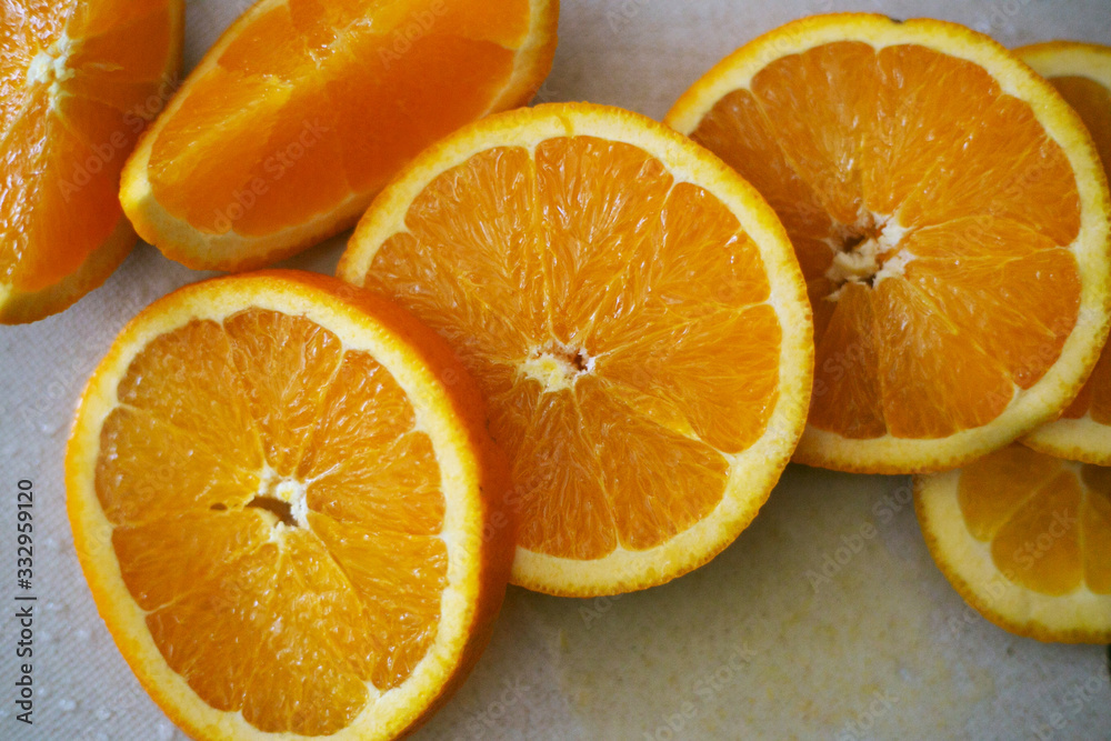 Slices of sweet orange on the table Slices of sweet orange on the table