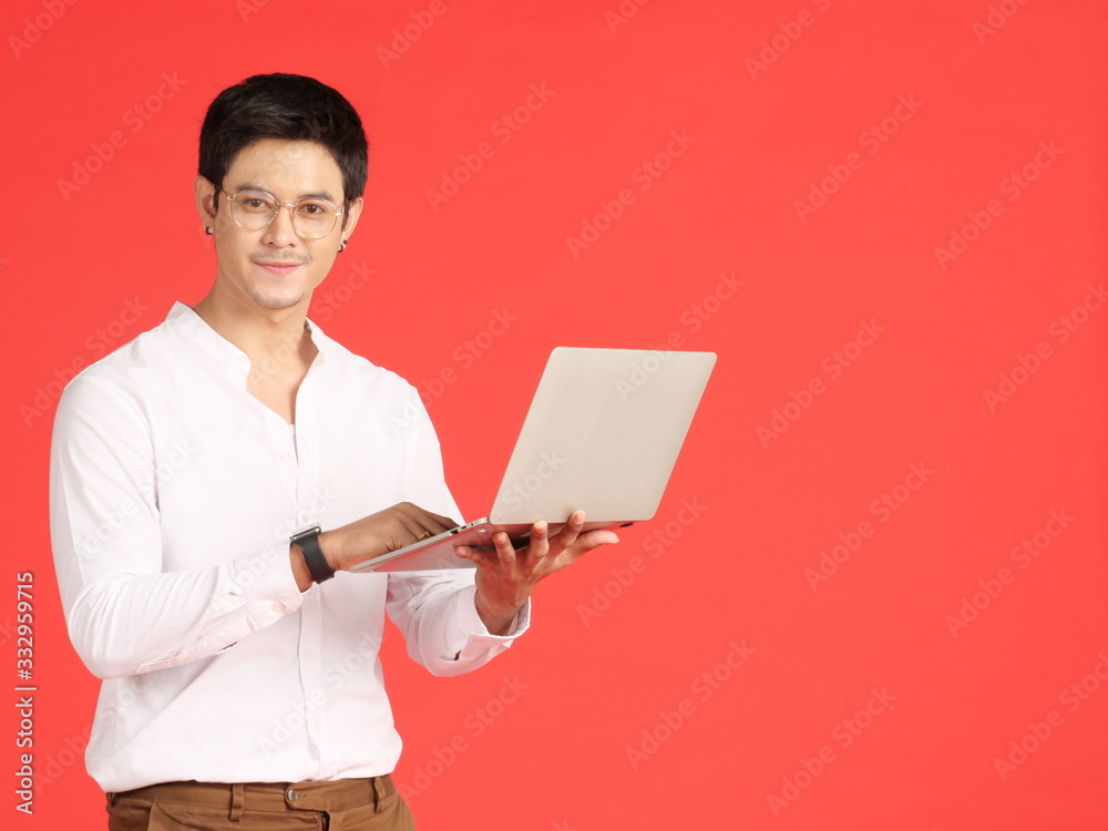 Asian business man sitting working with laptop. Asian business man sitting working with laptop.