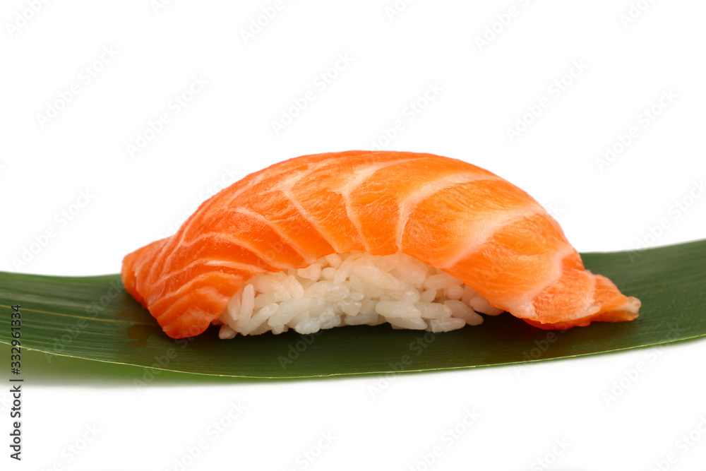 Close up one nigiri sushi with salmon on white