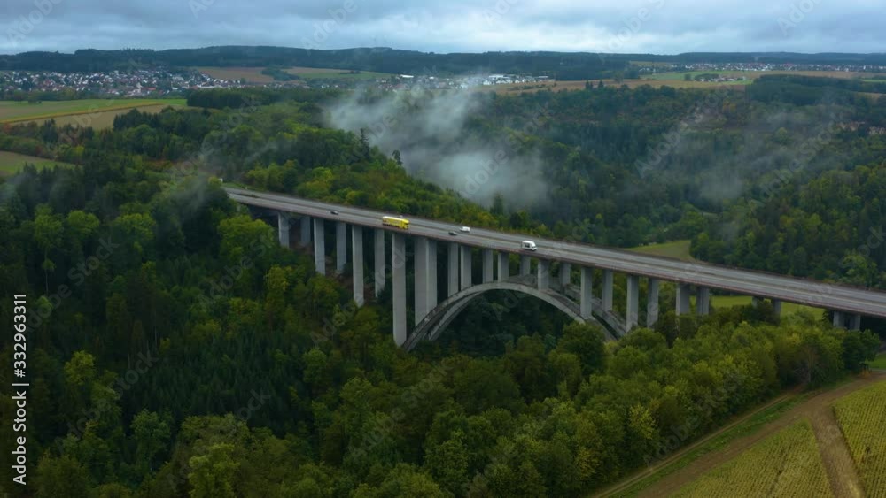 Aerial view of highway Autobahn bridge in Germany on a cloudy and fogy morning in fall. With time lapse Aerial view of highway Autobahn bridge in Germany on a cloudy and fogy morning in fall. With time lapse