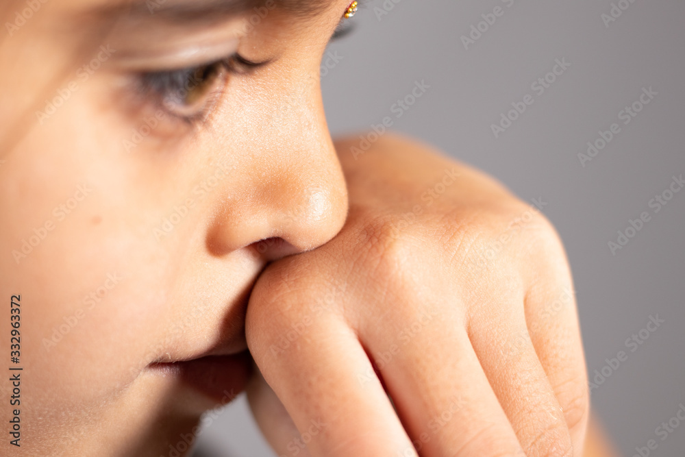 Extreme close up of child touch's her Nose concept showing to prevent