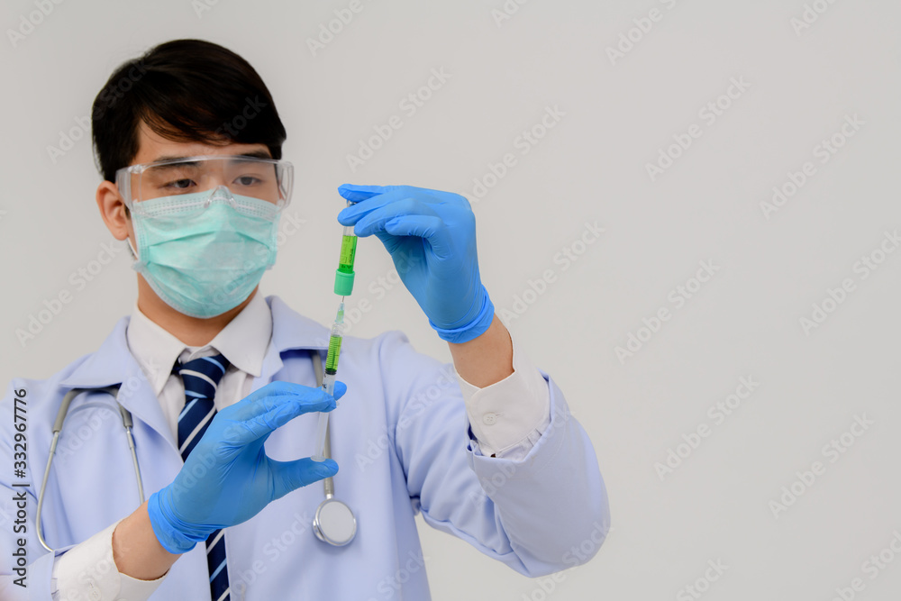 Doctors carrying an infected blood sample in a sample tube with DNA strains, coronavirus covid 19 vaccine research with the coronavirus vaccine 2019-nCoV COVID in a chemical research laboratory. Doctors carrying an infected blood sample in a sample tube with DNA strains, coronavirus covid 19 vaccine research with the coronavirus vaccine 2019-nCoV COVID in a chemical research laboratory.