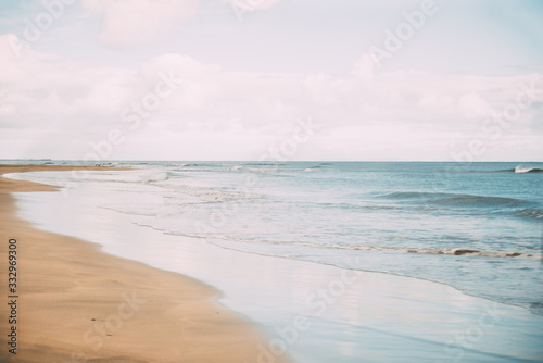 Desert beach with calm sea. Copy space.Concept of summer