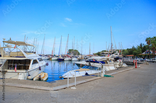 Yachts at the pier in summer at the port © MaksimM