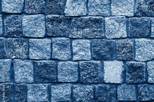 Granite stones wall background classic blue toned