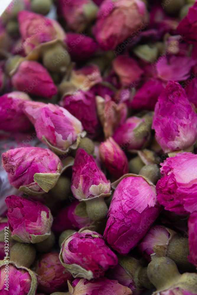 Petals and buds of dried pink tea roses. Top view. Flowers background. Rose flowers spice. Petals and buds of dried pink tea roses. Top view. Flowers background. Rose flowers spice.
