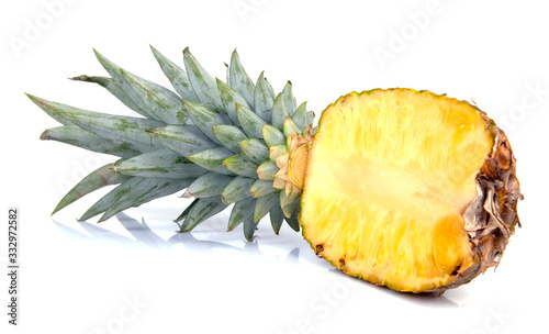 Half cut pineapple over white background
