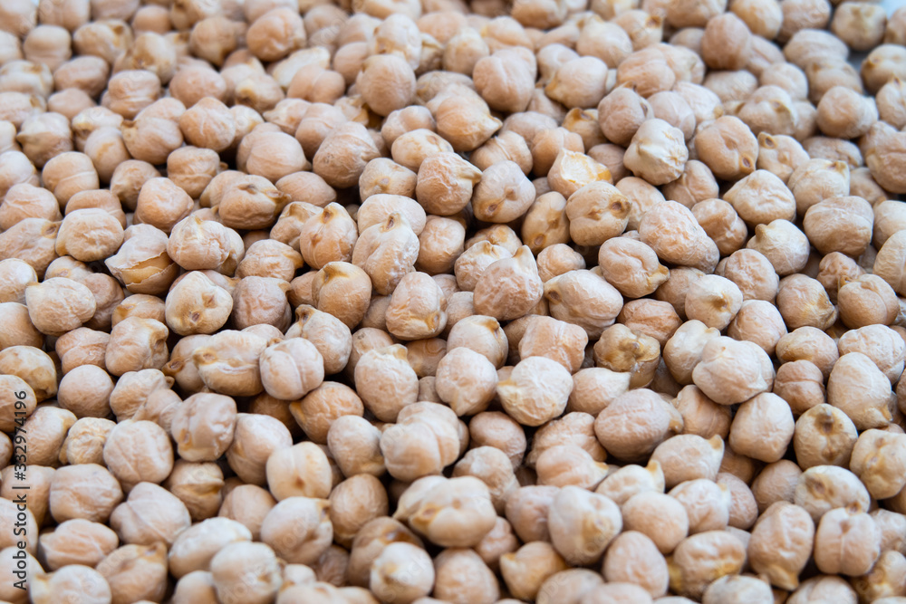Closeup of stacked chickpeas on display with focus in the middle Closeup of stacked chickpeas on display with focus in the middle