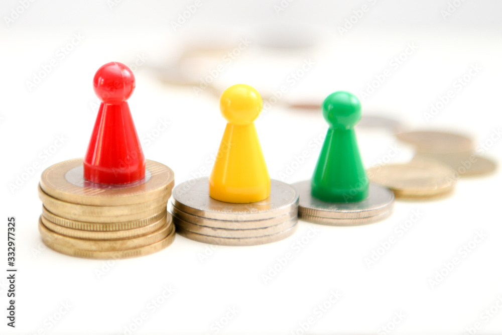 colorful figures standing on podium of coins 1, 2, 3 place. Financial concept colorful figures standing on podium of coins 1, 2, 3 place. Financial concept