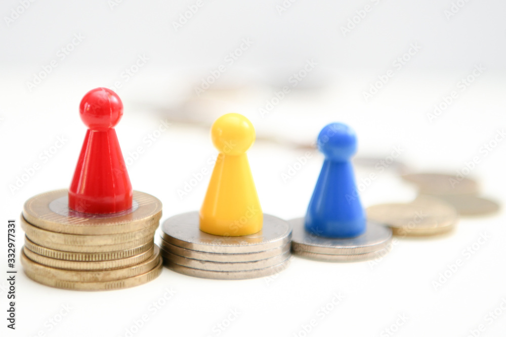 colorful figures standing on podium of coins 1, 2, 3 place. Financial concept colorful figures standing on podium of coins 1, 2, 3 place. Financial concept