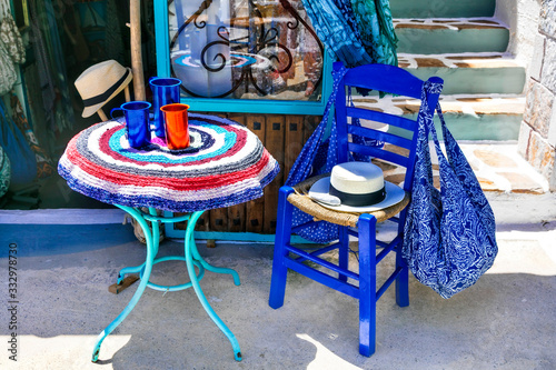 Fototapeta Naklejka Na Ścianę i Meble -  Charming souveir shops and street bars in Greece. Amorgos island, Cyclades