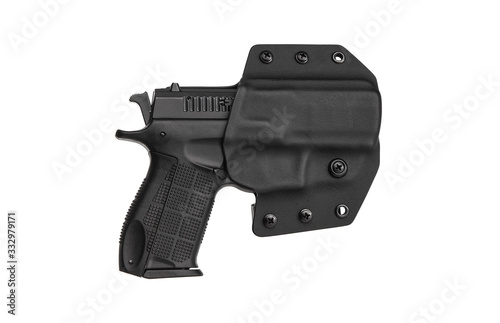 Gun in holster. Modern plastic holster for gun isolate on white back photo