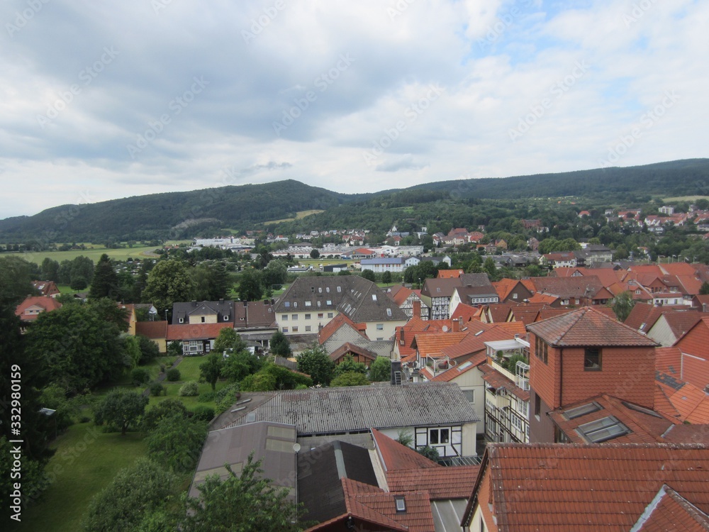 This picture is showing a beautiful town and natural landscape with cloudy sky. 