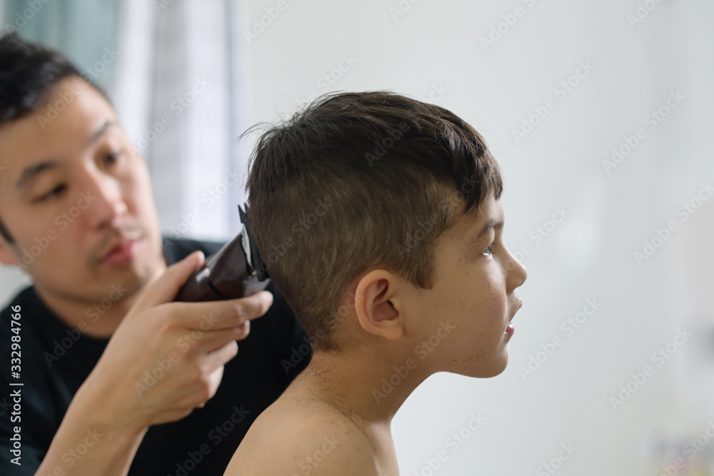 Dad giving son a haircut Dad giving son a haircut