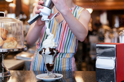 Making ice cream sundae photo