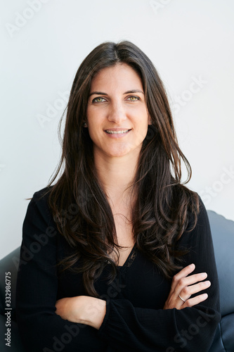 Portrait of brunette millennial in studio.