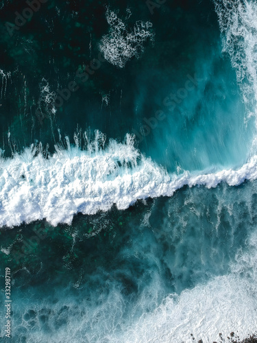 Aerial drone view of spashing waves in blue ocean Fototapet