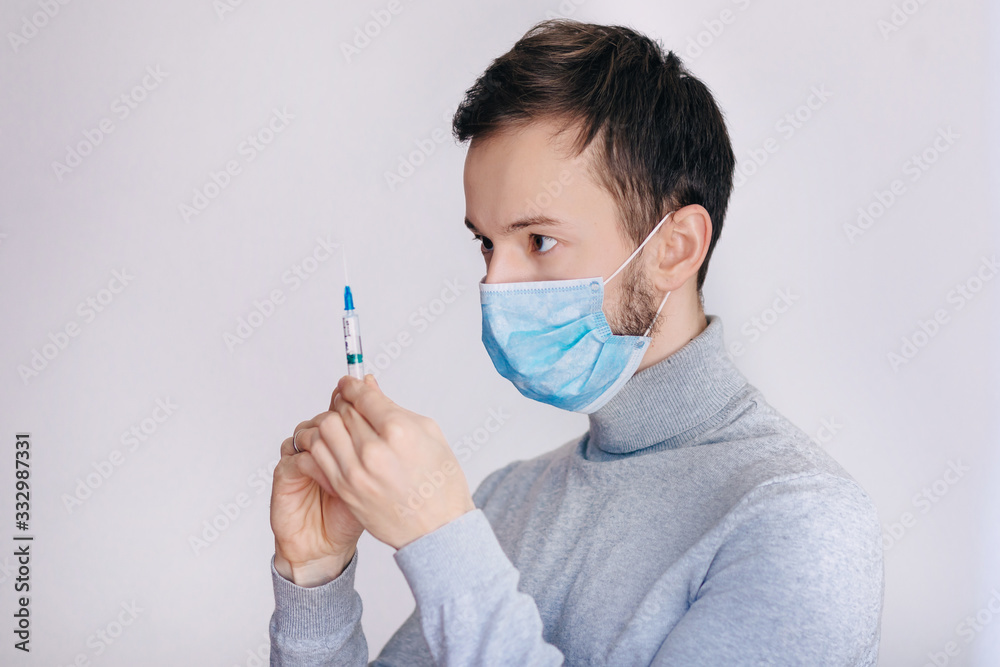treatment concept. man curing sick people. look at the syringe treatment concept. man curing sick people. look at the syringe