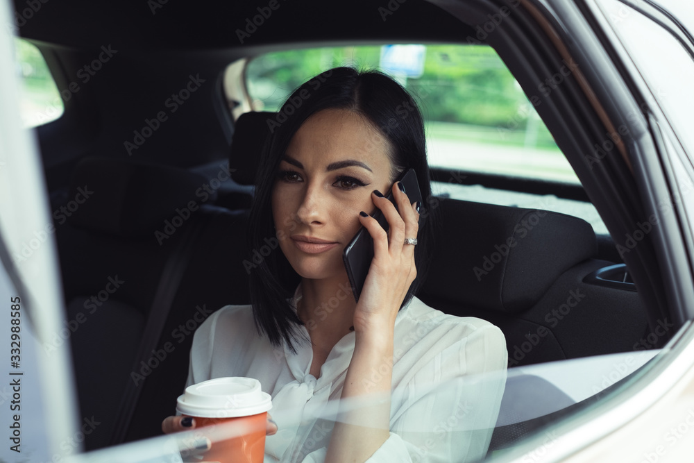 Modern Businesswoman in a Car