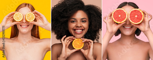 Optimistic multiracial women showing fresh citruses