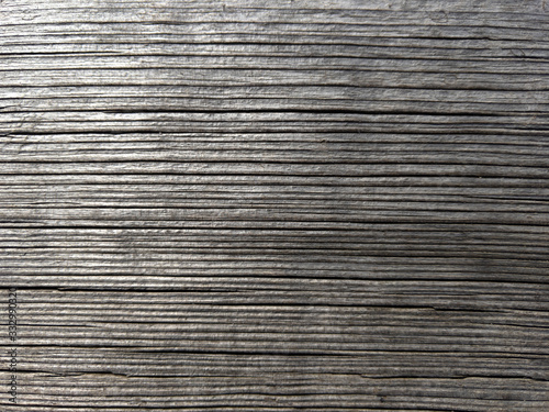 Old wooden wrinkled board. Tree texture with copyspace. Stock photo.