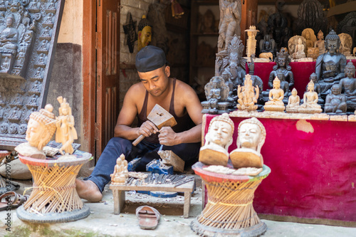 Craftsman Carving Wooden Figures in a Nepalese Village