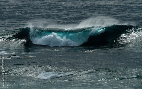 blue green waves splash and roll along the coast of California © David Halgrimson