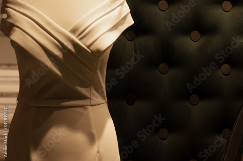 elegant white sheath dress on a mannequin