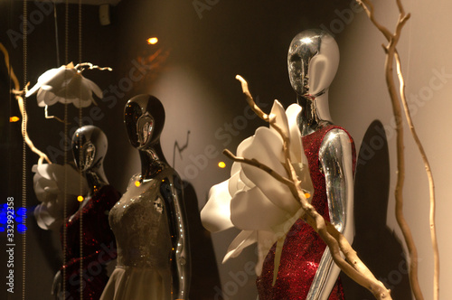 A display of dresses dresses on a mannequin in the store, lace & silky, evening, prom, wedding, special events dresses.