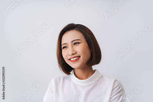 Portrait of beautiful young asian woman happiness standing on gray photo