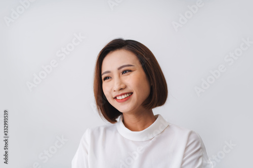 Portrait of beautiful young asian woman happiness standing on gray