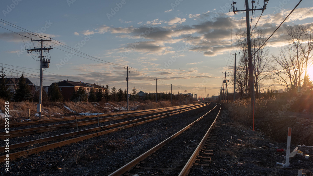 Railroad tracks by the sunset