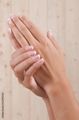 very well-groomed woman's hands in a skin treatment in a spa