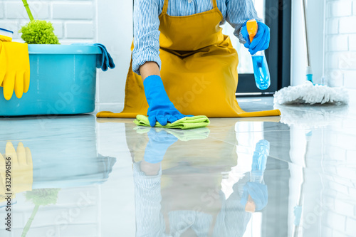 Bild auf Leinwand Wife housekeeping and cleaning concept, Happy young woman in blue rubber gloves