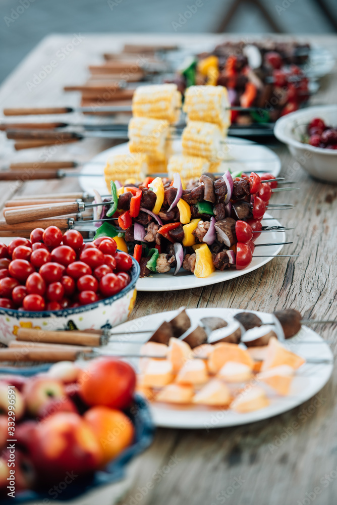 Kabobs and fruits on table Kabobs and fruits on table