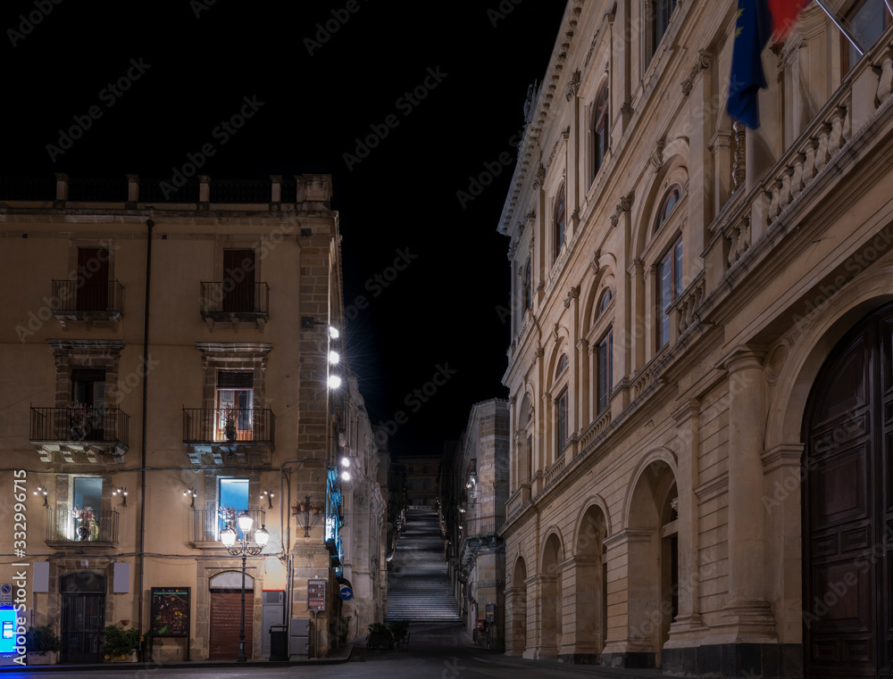 Empty street of the sicilian town Caltagirone at night and view of its famous stairs, province of Catania, Sicily