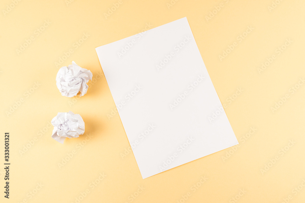 White empty sheet of paper on beige background. White empty sheet of paper on beige background.
