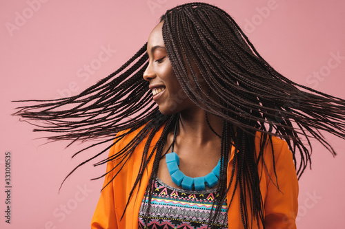 Portrait Of Beautiful Smiling African-American Woman With Bradis photo