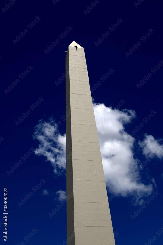 he Obelisk or El Obelisco, Buenos Aires `s most famous monument against blue sky