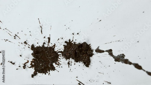 Super Slow Motion Shot of Splashing Mud on White Cloth at 1000fps.