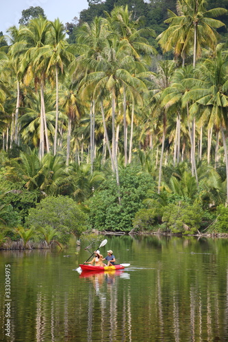 Men and women are kayaking in the canal