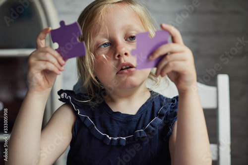 Child doing a jigsaw puzzles