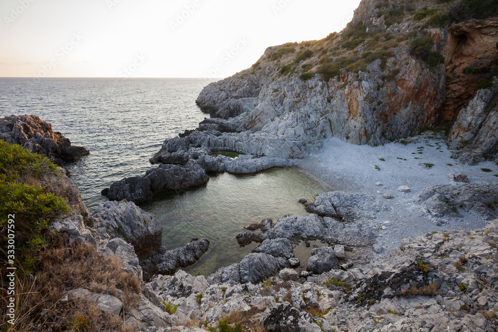 beautiful rocky beach of the Protected Marine Area Costa degli Infreschi and Masseta in the Cilento and Diano Valley National Park, Marina di Camerota, Scario, Salerno, Italy beautiful rocky beach of the Protected Marine Area Costa degli Infreschi and Masseta in the Cilento and Diano Valley National Park, Marina di Camerota, Scario, Salerno, Italy