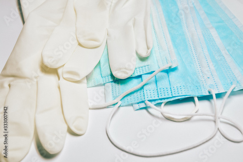 Medical masks and sterile gloves. Coronavirus protection concept. One of the ways to reduce the spread of virus. Prevention the spread of COVID-19.