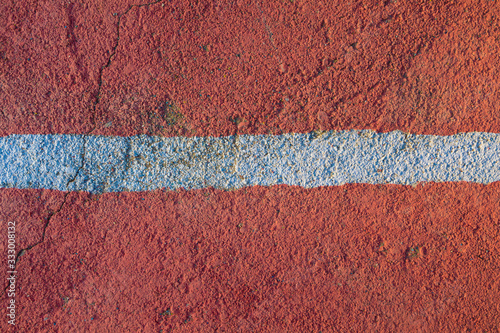 Floor of a concrete outdoor sports court, painted in an intense, vivid and saturated color, represents the concept of change, limit or transformation. This photo was taken in Indonesia.