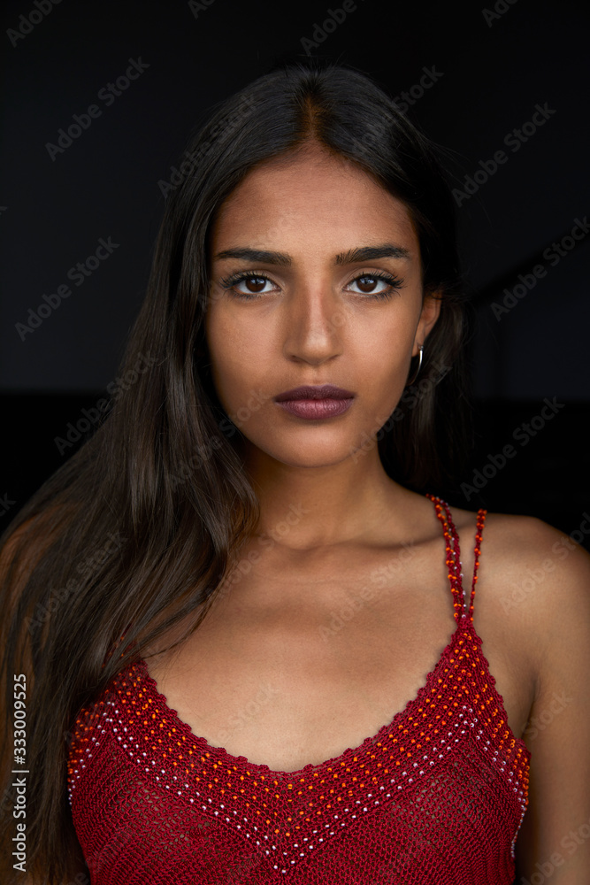 Serious young female in red top Serious young female in red top