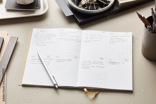 Handwritten notes in weekly planner photo