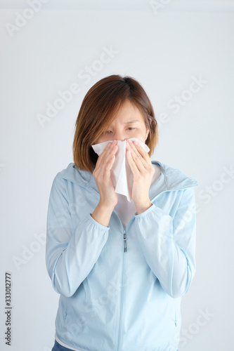 woman wearing mask get sick from corona virus, covid19, flu symptom as sneezing, cough, fever, body ache, breathing , pain.